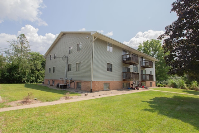 view of property exterior featuring a yard and central AC
