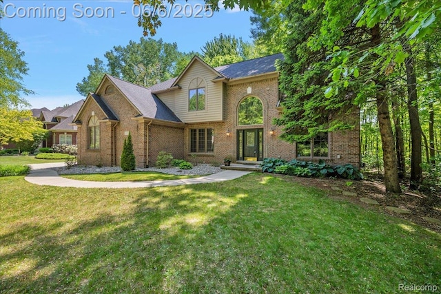 53629 Wayburn Ct, Utica, MI 48315 - traditional-style house with brick siding and a front yard