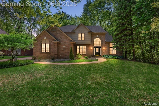 53629 Wayburn Ct, Utica, MI 48315 - traditional-style home with brick siding and a front yard