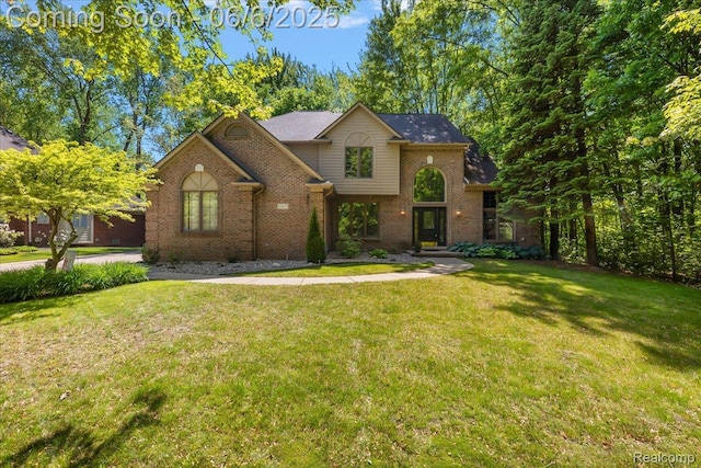 53629 Wayburn Ct, Utica, MI 48315 - traditional home featuring brick siding and a front lawn
