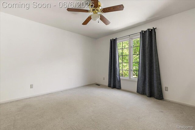 53629 Wayburn Ct, Utica, MI 48315 - empty room with light carpet, baseboards, and a ceiling fan
