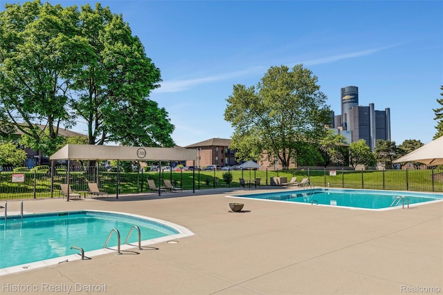 1300 E Lafayette St Unit 1604, Detroit, MI 48207 - community pool featuring a patio area