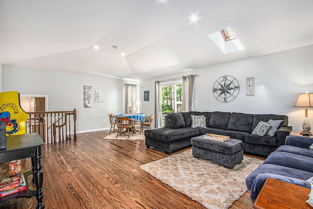61564 Park St, Cassopolis, MI 49031 - living area featuring vaulted ceiling, dark wood-type flooring, a skylight, and baseboards