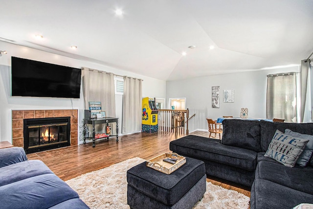 61564 Park St, Cassopolis, MI 49031 - living area with wood finished floors, vaulted ceiling, and a tile fireplace