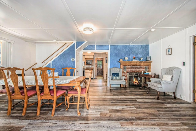 61564 Park St, Cassopolis, MI 49031 - dining space with wood finished floors and a brick fireplace