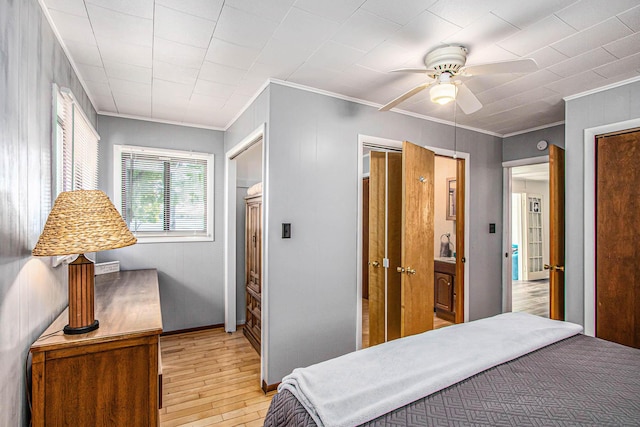 61564 Park St, Cassopolis, MI 49031 - bedroom with light wood-style flooring, ornamental molding, and ceiling fan