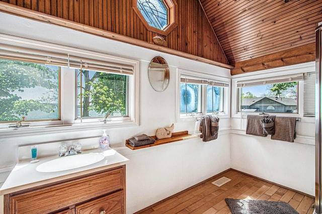61564 Park St, Cassopolis, MI 49031 - bathroom featuring wooden ceiling, lofted ceiling, hardwood / wood-style flooring, and vanity