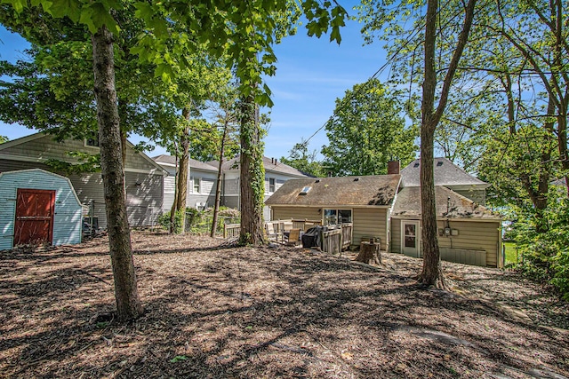 61564 Park St, Cassopolis, MI 49031 - back of house featuring a chimney and roof with shingles