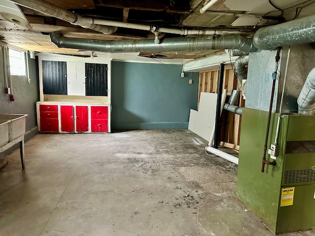below grade area featuring heating unit