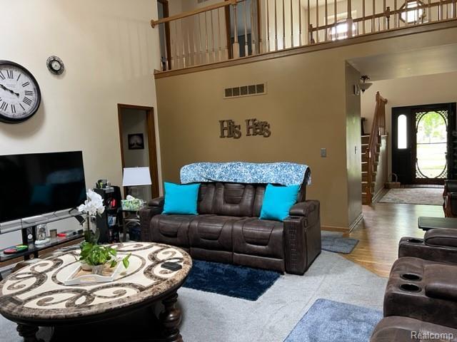 15743 Greenview, Fraser, MI 48026 - living room featuring a towering ceiling and baseboards