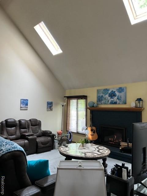15743 Greenview, Fraser, MI 48026 - living area featuring a skylight, vaulted ceiling, healthy amount of natural light, and a fireplace