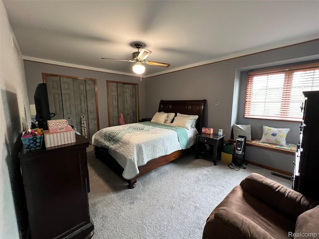 15743 Greenview, Fraser, MI 48026 - bedroom featuring multiple closets, carpet floors, a ceiling fan, and ornamental molding