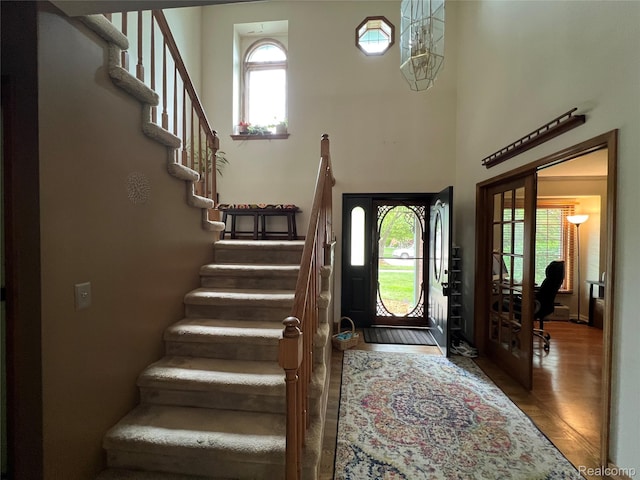 15743 Greenview, Fraser, MI 48026 - entryway featuring wood finished floors, stairway, and a towering ceiling