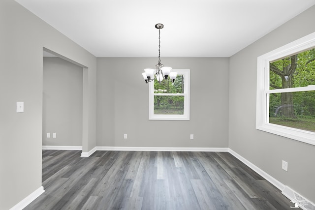 6505 Clover Ln, Lambertville, MI 48144 - spare room with a chandelier, dark wood-style flooring, and baseboards