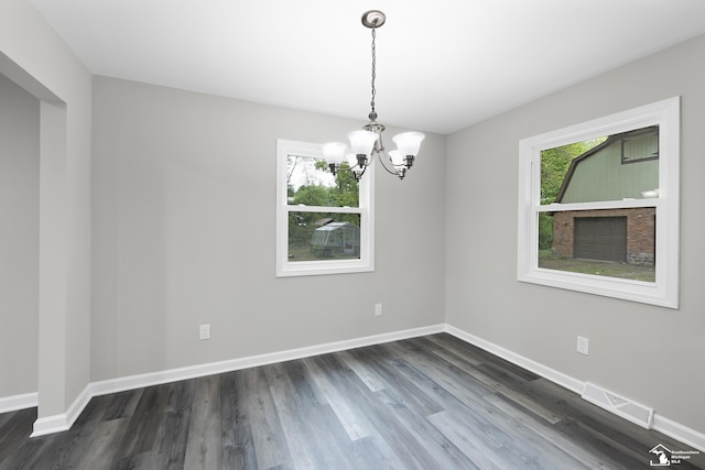 6505 Clover Ln, Lambertville, MI 48144 - empty room with a chandelier, dark wood-style floors, and baseboards