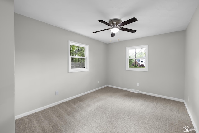 6505 Clover Ln, Lambertville, MI 48144 - carpeted empty room featuring plenty of natural light, ceiling fan, and baseboards