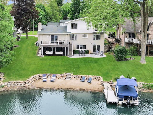 3732 Loch Dr, Highland, MI 48357 - back of house with stairs, a patio, a yard, a chimney, and a deck with water view