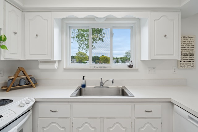 3732 Loch Dr, Highland, MI 48357 - kitchen with a sink, white electric range oven, white cabinetry, and light countertops