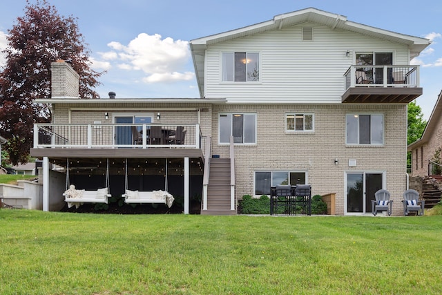 3732 Loch Dr, Highland, MI 48357 - rear view of house featuring stairway, a chimney, a yard, and a wooden deck