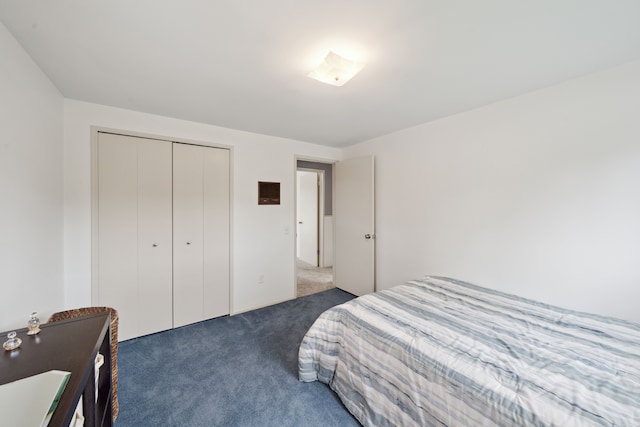 3732 Loch Dr, Highland, MI 48357 - bedroom with dark colored carpet and a closet