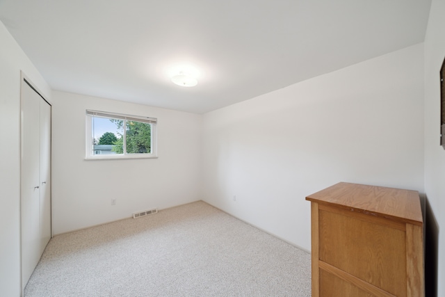 3732 Loch Dr, Highland, MI 48357 - unfurnished bedroom featuring carpet