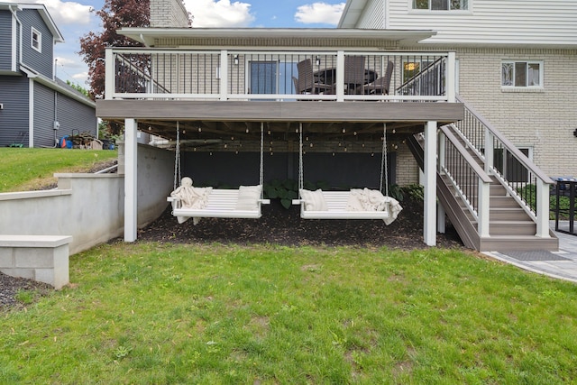 3732 Loch Dr, Highland, MI 48357 - back of property featuring a deck, stairway, a lawn, and brick siding