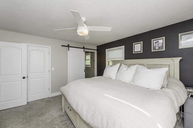 9561 Springville Hwy, Onsted, MI 49265 - bedroom featuring light colored carpet, a barn door, a ceiling fan, and baseboards