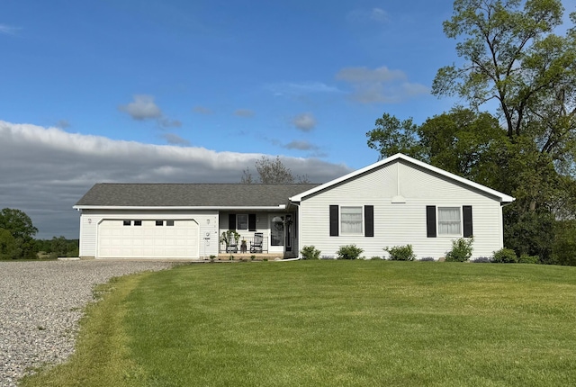 9561 Springville Hwy, Onsted, MI 49265 - ranch-style house featuring a front yard, a garage, and gravel driveway