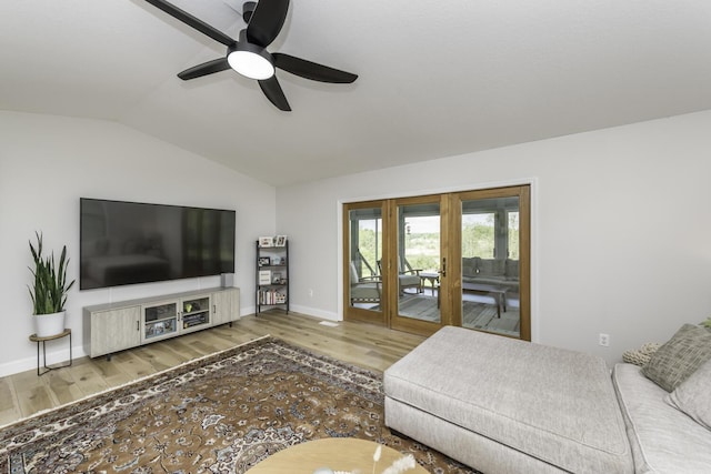 9561 Springville Hwy, Onsted, MI 49265 - living area featuring lofted ceiling, wood finished floors, ceiling fan, and baseboards