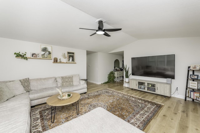 9561 Springville Hwy, Onsted, MI 49265 - living area with a ceiling fan, vaulted ceiling, wood finished floors, and baseboards
