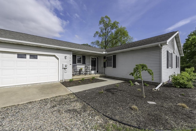 9561 Springville Hwy, Onsted, MI 49265 - ranch-style house featuring covered porch, driveway, and an attached garage