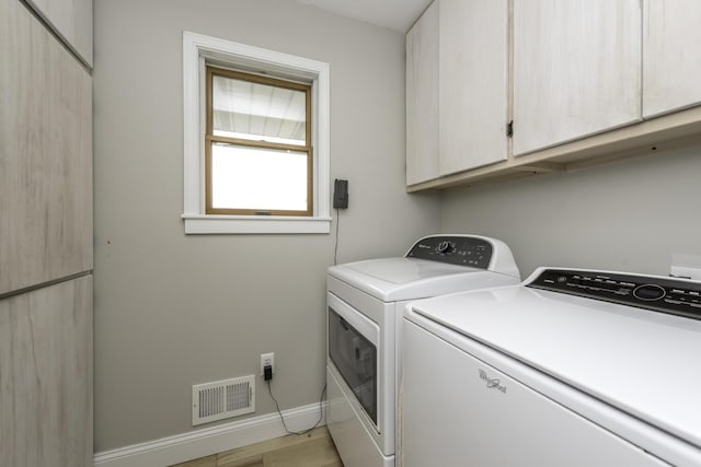 9561 Springville Hwy, Onsted, MI 49265 - laundry room featuring cabinet space, independent washer and dryer, and baseboards