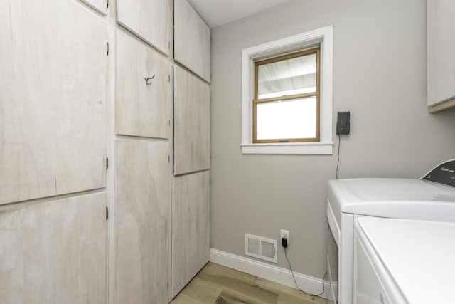 9561 Springville Hwy, Onsted, MI 49265 - washroom featuring cabinet space, washer and dryer, and baseboards