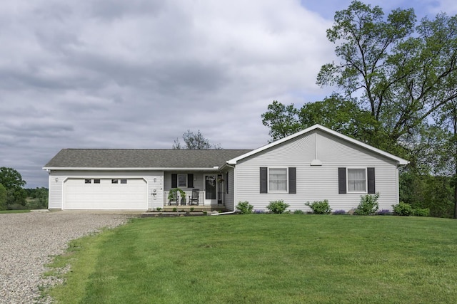 9561 Springville Hwy, Onsted, MI 49265 - single story home featuring gravel driveway, an attached garage, and a front yard