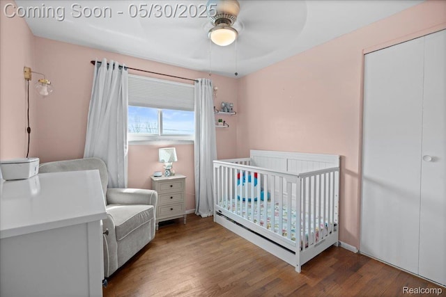 771 Easley Dr, Westland, MI 48186 - bedroom with wood finished floors, a crib, ceiling fan, and a closet