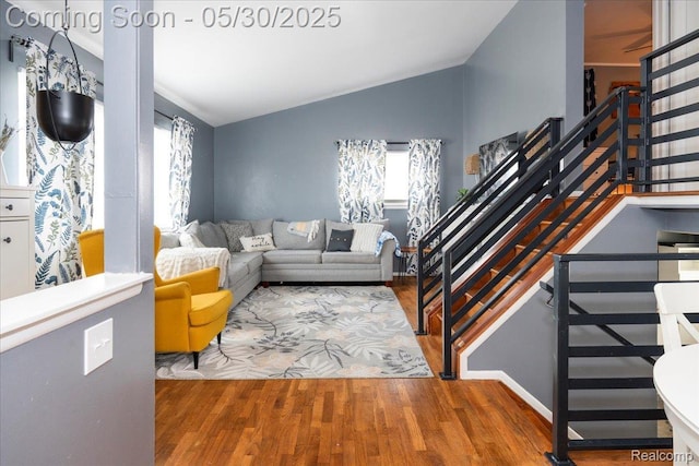 771 Easley Dr, Westland, MI 48186 - living area with lofted ceiling, wood finished floors, and stairway