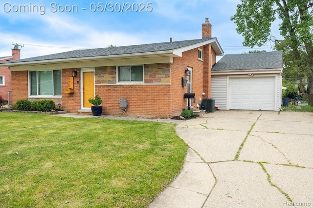 771 Easley Dr, Westland, MI 48186 - view of front of property featuring a chimney, driveway, an attached garage, brick siding, and a front yard