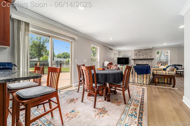 4715 Mandalay Ave, Royal Oak, MI 48073 - dining area with light wood-type flooring, ornamental molding, recessed lighting, and a fireplace