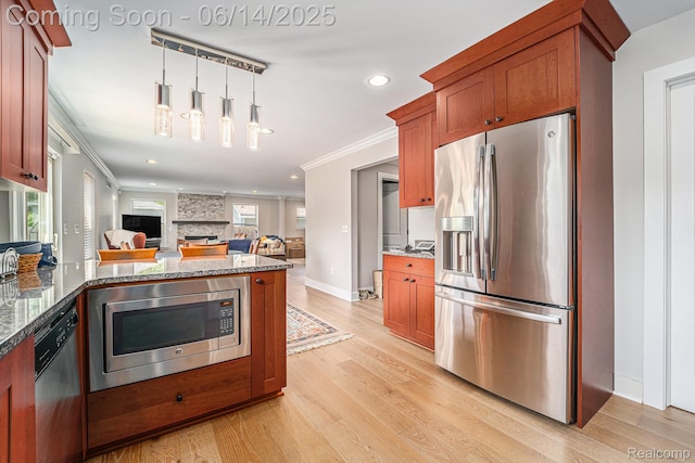 4715 Mandalay Ave, Royal Oak, MI 48073 - kitchen with stainless steel appliances, ornamental molding, light wood-style flooring, stone countertops, and brown cabinetry