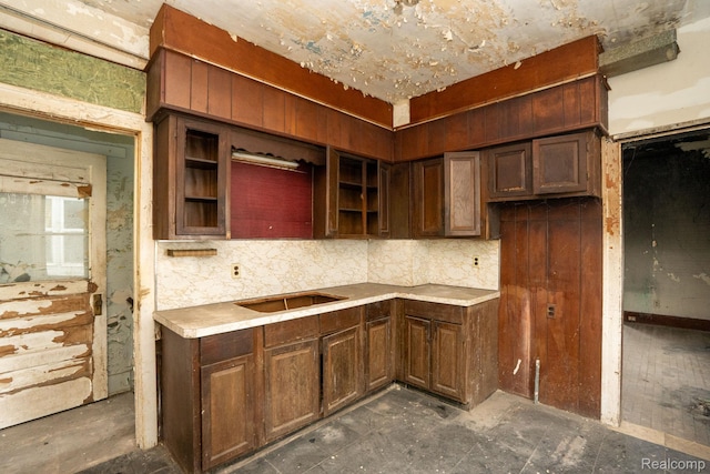 17257 Moenart St, Hamtramck, MI 48212 - kitchen with open shelves, backsplash, and light countertops