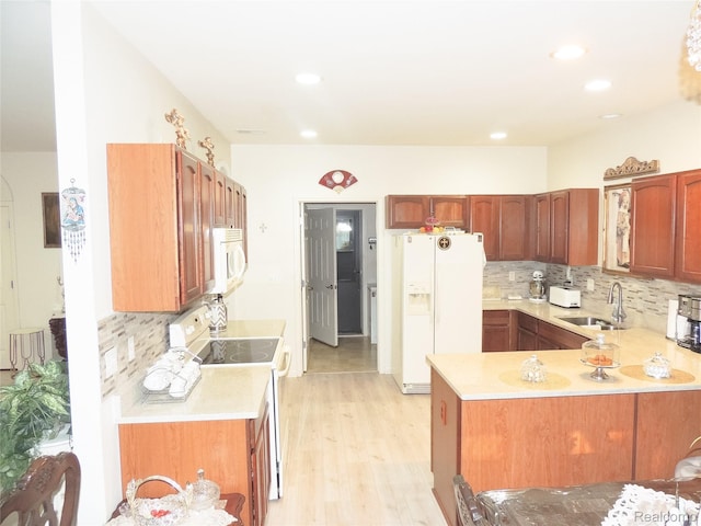 14478 Shadywood Dr, Sterling Heights, MI 48312 - kitchen featuring white appliances, a sink, light countertops, backsplash, and recessed lighting