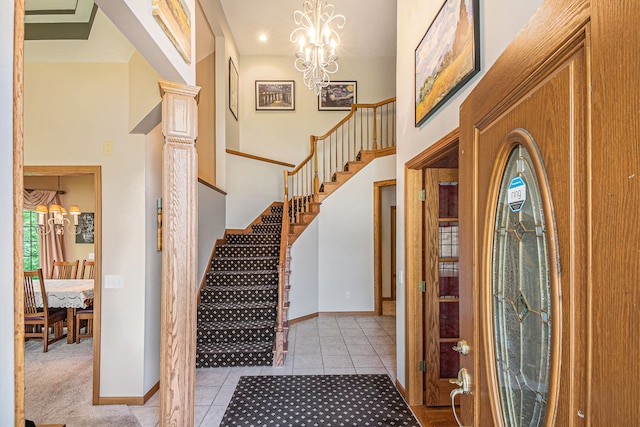 1506 Golfside Ct, Flushing, MI 48433 - entrance foyer featuring stairs, light tile patterned flooring, a chandelier, baseboards, and a towering ceiling