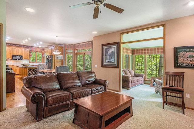 1506 Golfside Ct, Flushing, MI 48433 - living area featuring light carpet, recessed lighting, ceiling fan, and baseboards