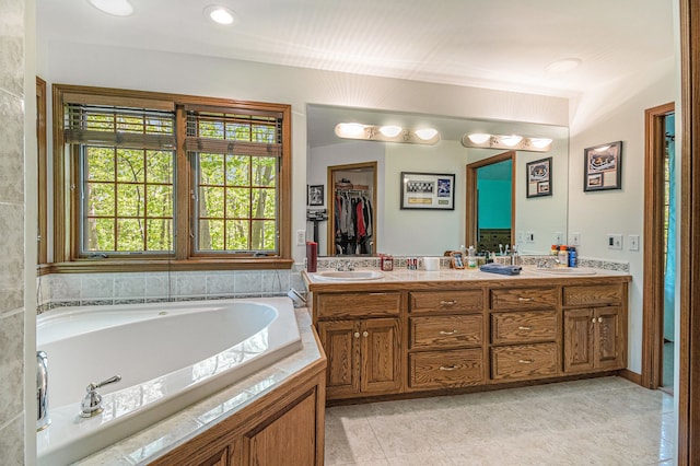 1506 Golfside Ct, Flushing, MI 48433 - bathroom with tile patterned floors, a garden tub, and double vanity