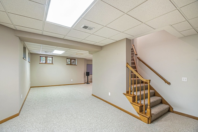 1506 Golfside Ct, Flushing, MI 48433 - below grade area featuring a paneled ceiling, baseboards, carpet, and stairs