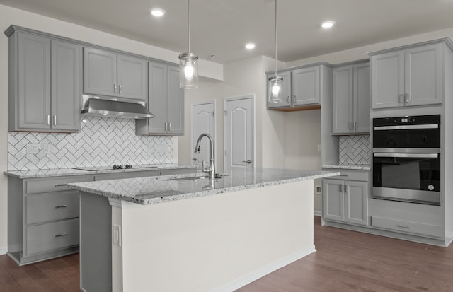 4062 Nottingham Cir, Clarkston, MI 48346 - kitchen with gray cabinets, a sink, under cabinet range hood, black electric stovetop, and recessed lighting
