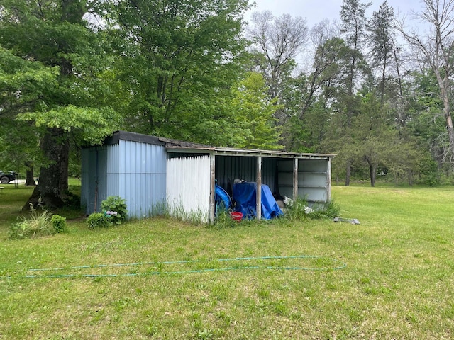 21576 Caberfae Hwy, Wellston, MI 49689 - view of green lawn featuring an outbuilding and a pole building