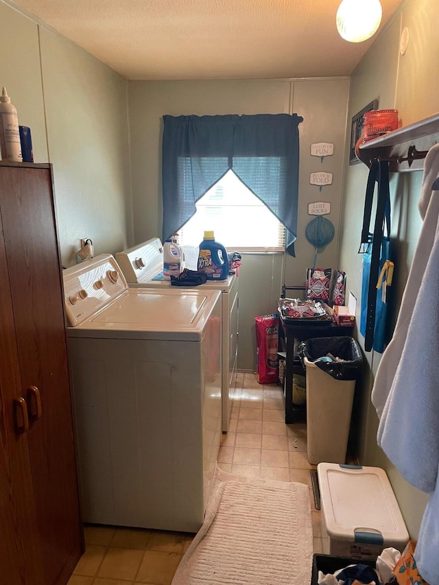 21576 Caberfae Hwy, Wellston, MI 49689 - laundry area featuring washer and dryer and light tile patterned flooring