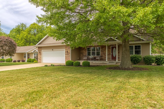 1373 Kristen Path, Saint Joseph, MI 49085 - view of front of property featuring a garage, concrete driveway, a porch, a front lawn, and stone siding