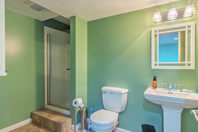1373 Kristen Path, Saint Joseph, MI 49085 - bathroom with a shower stall, baseboards, and toilet